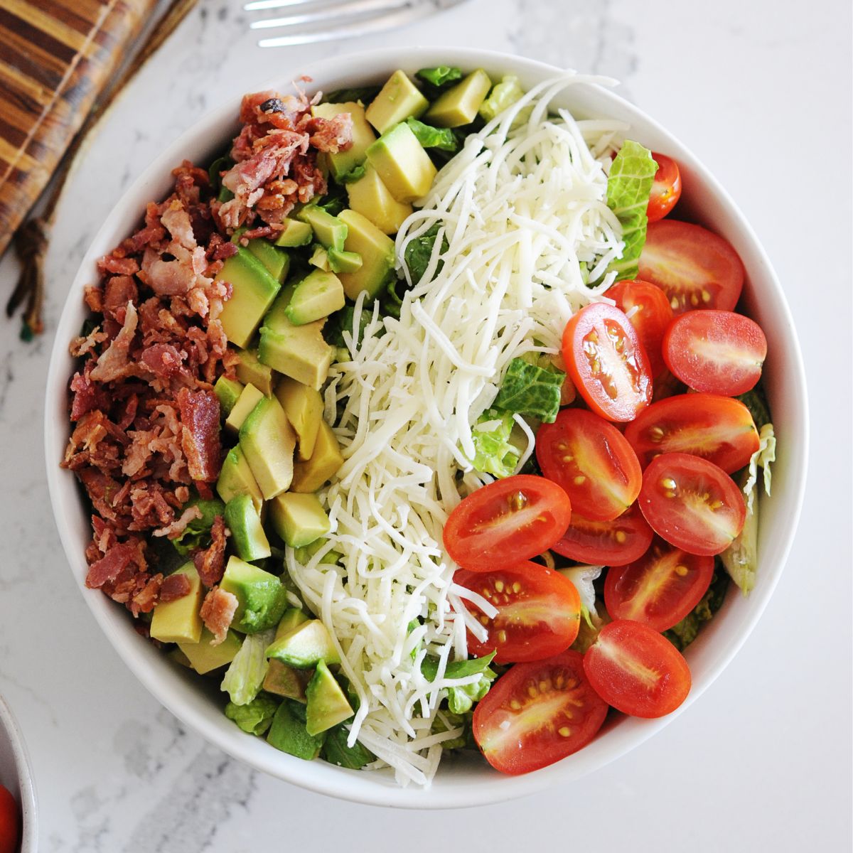 large bowl of BLT salad with all the toppings