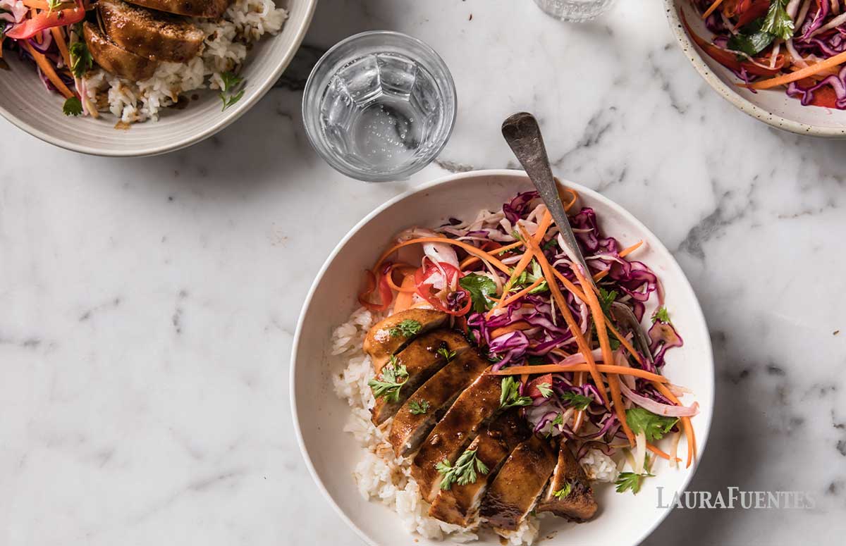 image: overhead shot of bowl of Korean chicken rice bowl