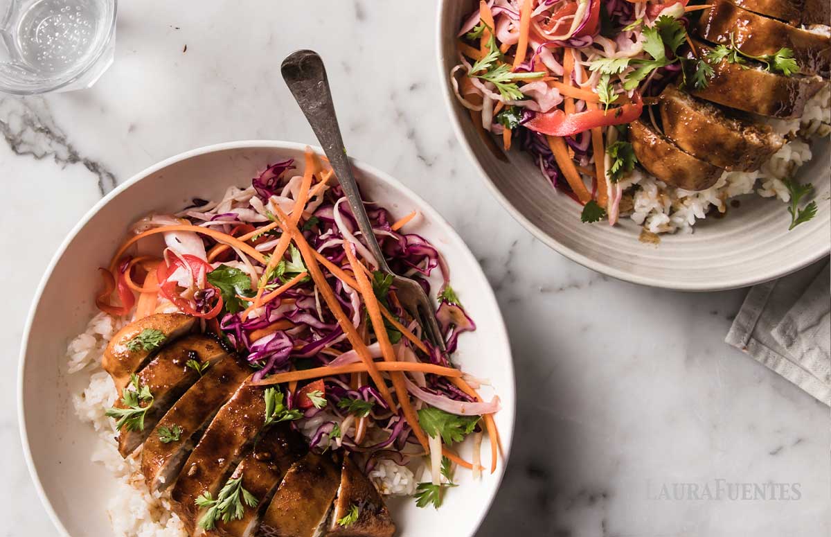 image: overhead shot of bowl of Korean chicken rice bowl