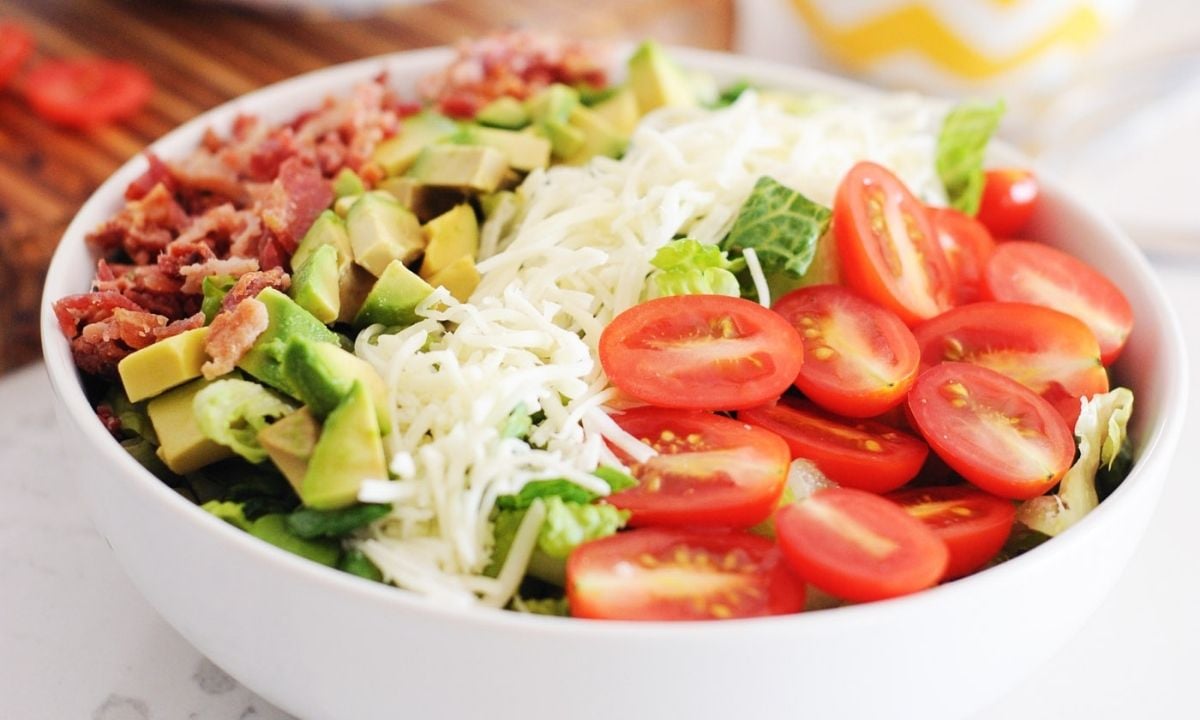 a BTL salad bowl made with bacon, avocado, cheese, lettuce and tomato
