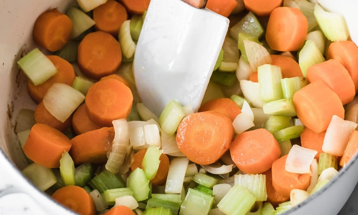 a large pot with carrots, celery and onion