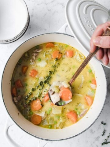 top view of a white pot with turkey stew