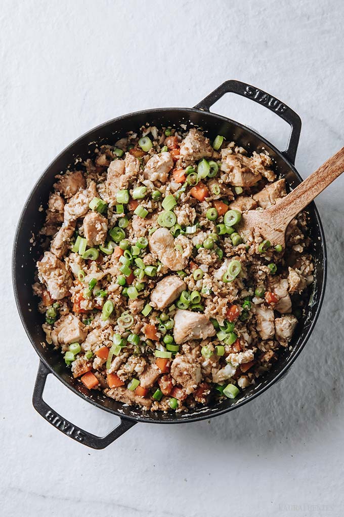 image: overhead view of skillet filled with healthy chicken fried rice.