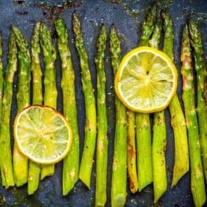 overhead view of roasted asparagus with lemon slices