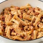 large skillet of sun dried tomato chicken pasta