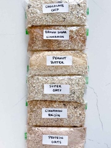 six flavored oatmeal packets labeled and lined up on a countertop