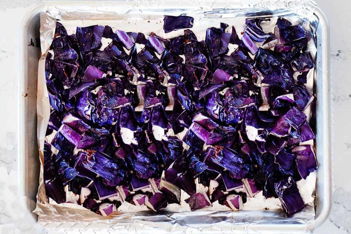 roasted red cabbage pieces in a baking sheet