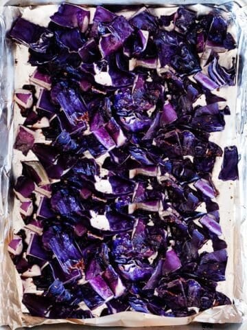 roasted red cabbage pieces in a baking sheet