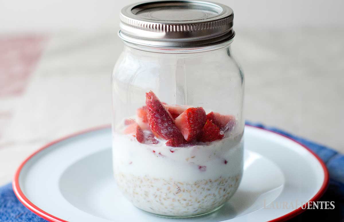 mason jar with overnight oats and strawberry slices