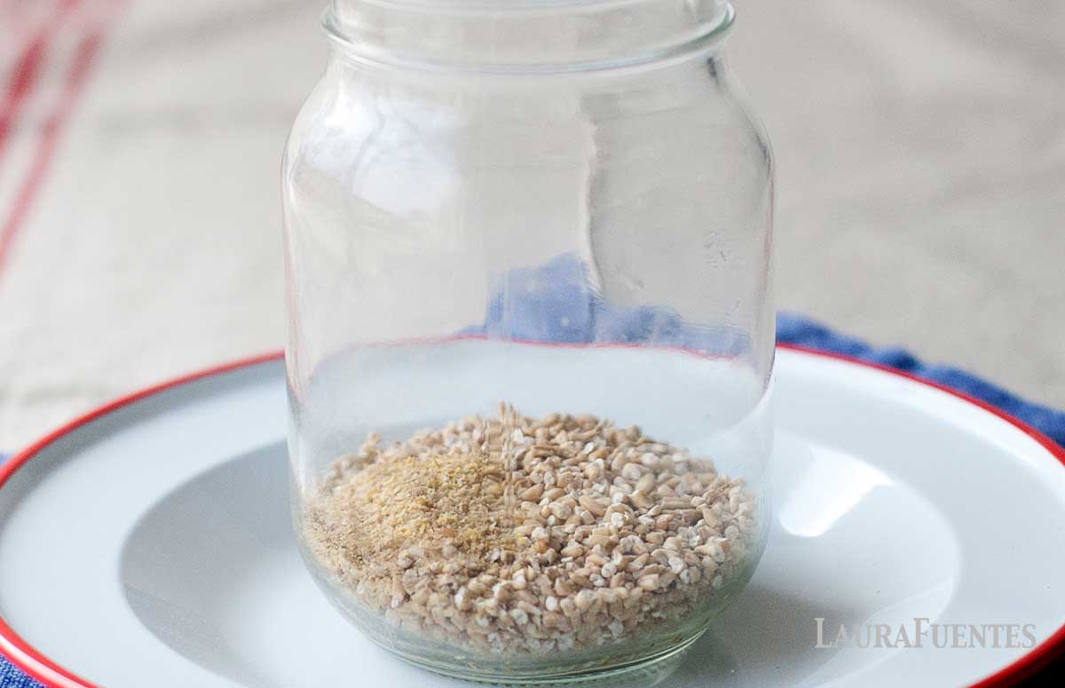 mason jar with steel cut oats in the bottom