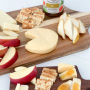 img: sliced apples pears and cheese on a board