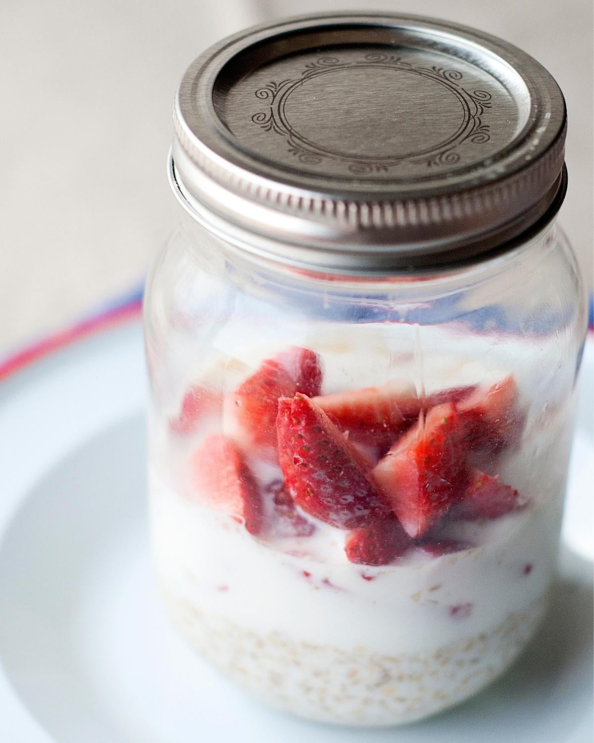 closeup of strawberry overnight oats in a mason jar