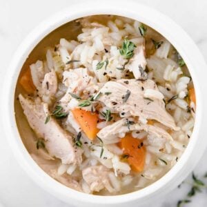 top view of a bowl of chicken and rice soup