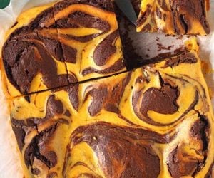 pumpkin swirl brownies being cut into squares