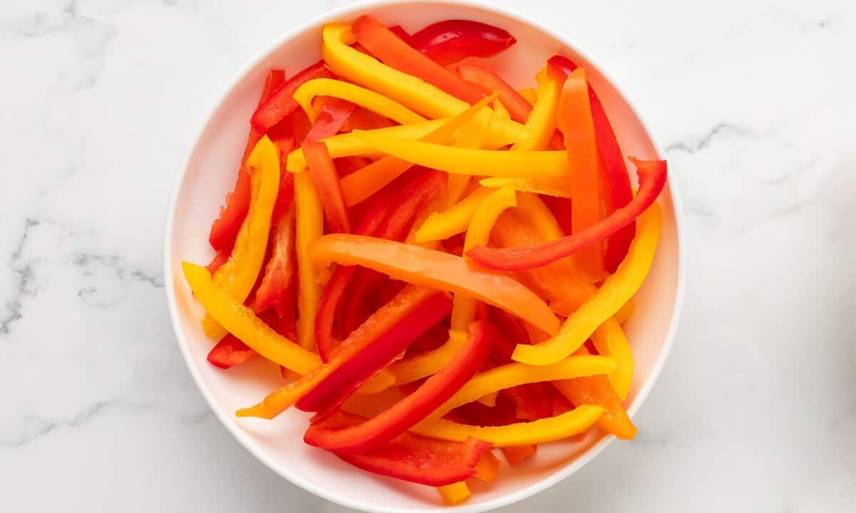 red and yellow bell peppers strips in a bowl