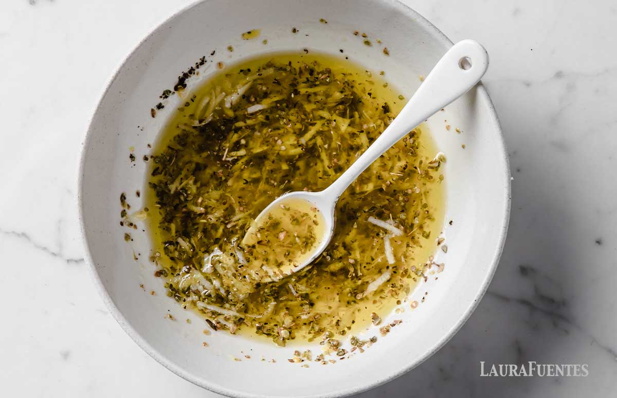 quick garlic lemon chicken marinade in a bowl 