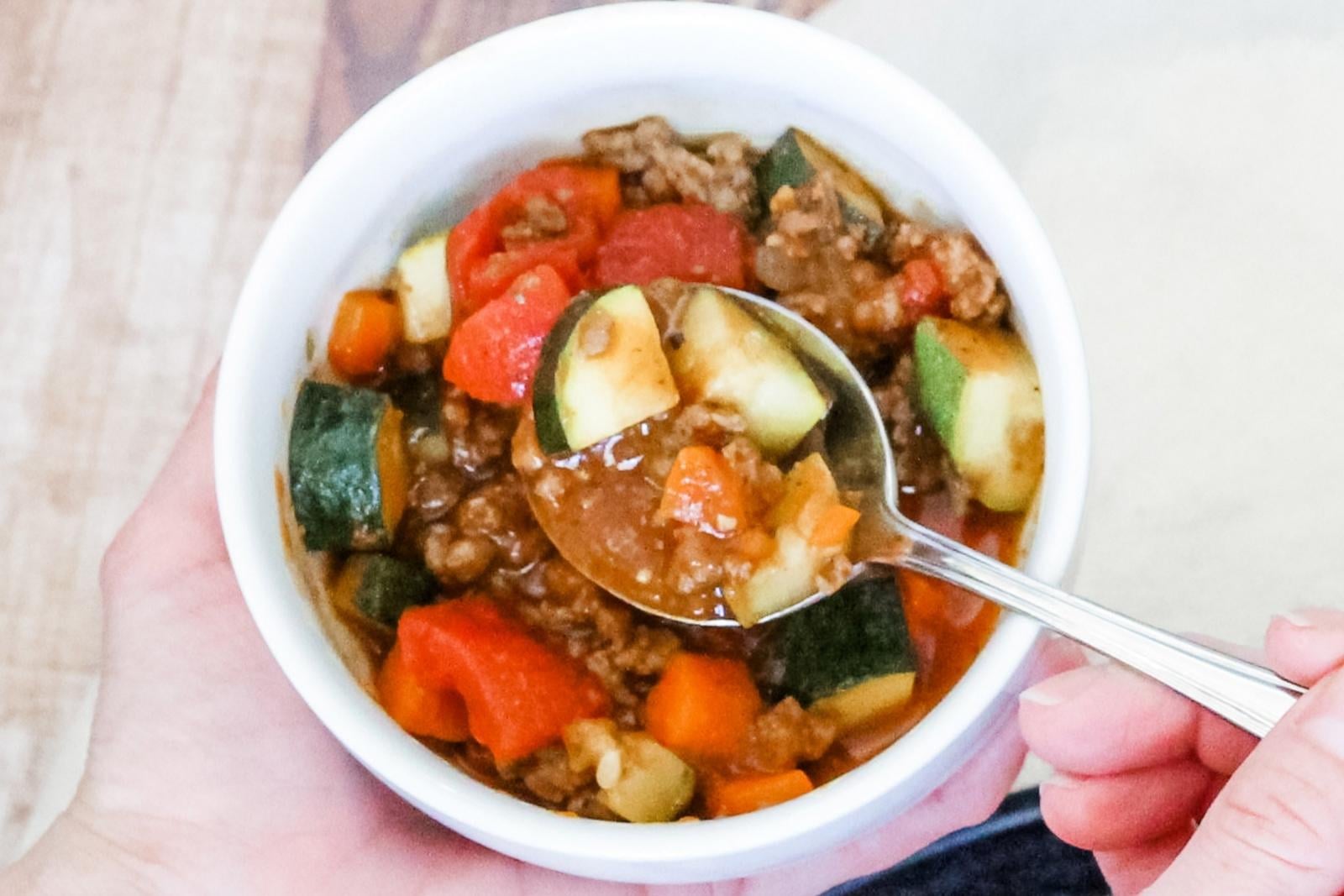 a bowl of paleo chili made with ground meat and veggies