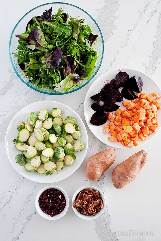 ingredients laid out in bowls for winter salad