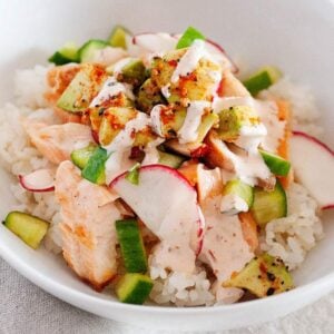avocado salmon bowl with cucumber and rice