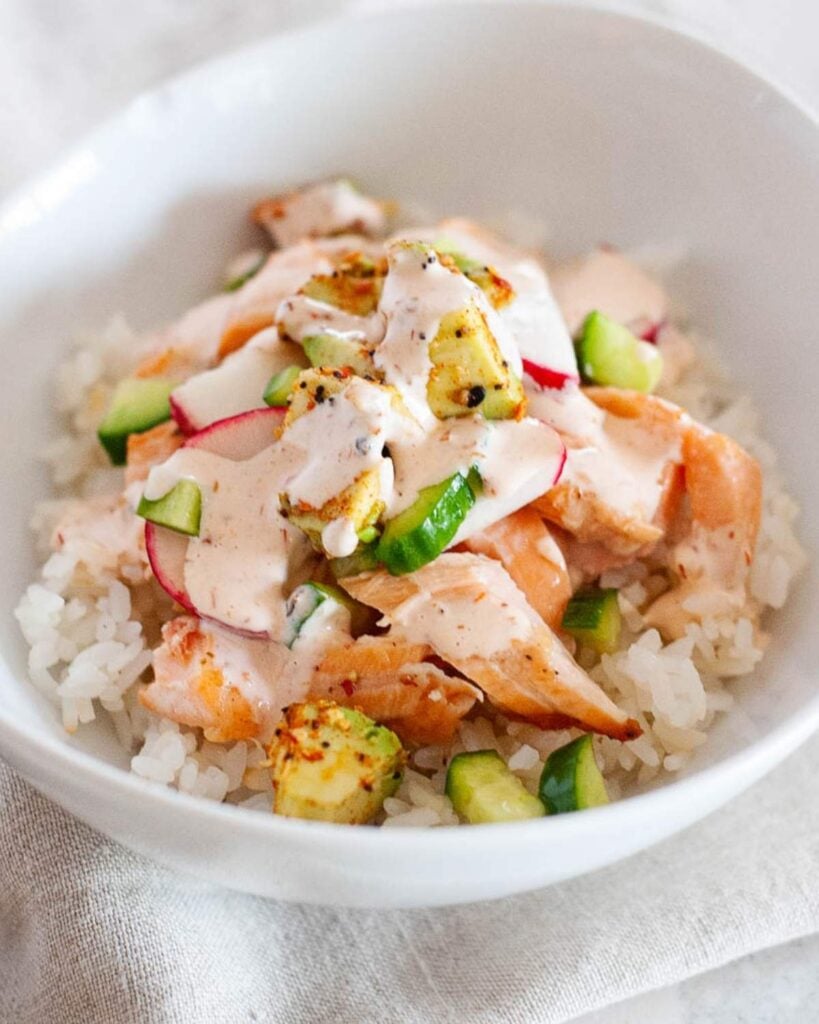 avocado salmon bowl with cucumber and rice