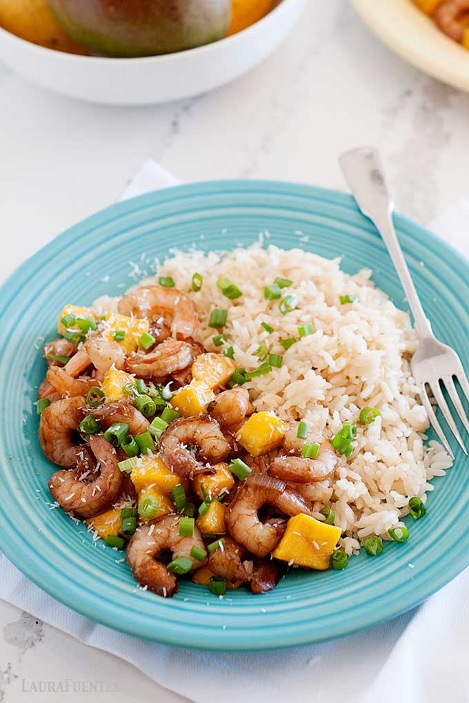 plate of mango shrimp stir fry and rice