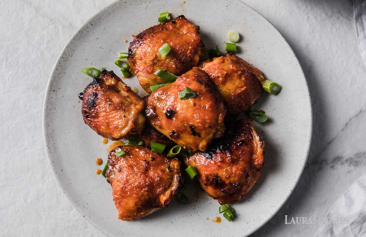 spicy chicken thighs on a serving plate
