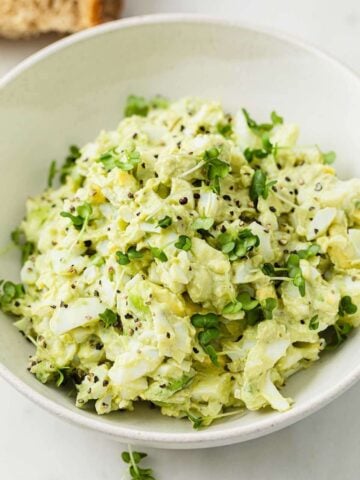 avocado egg salad in a white bowl