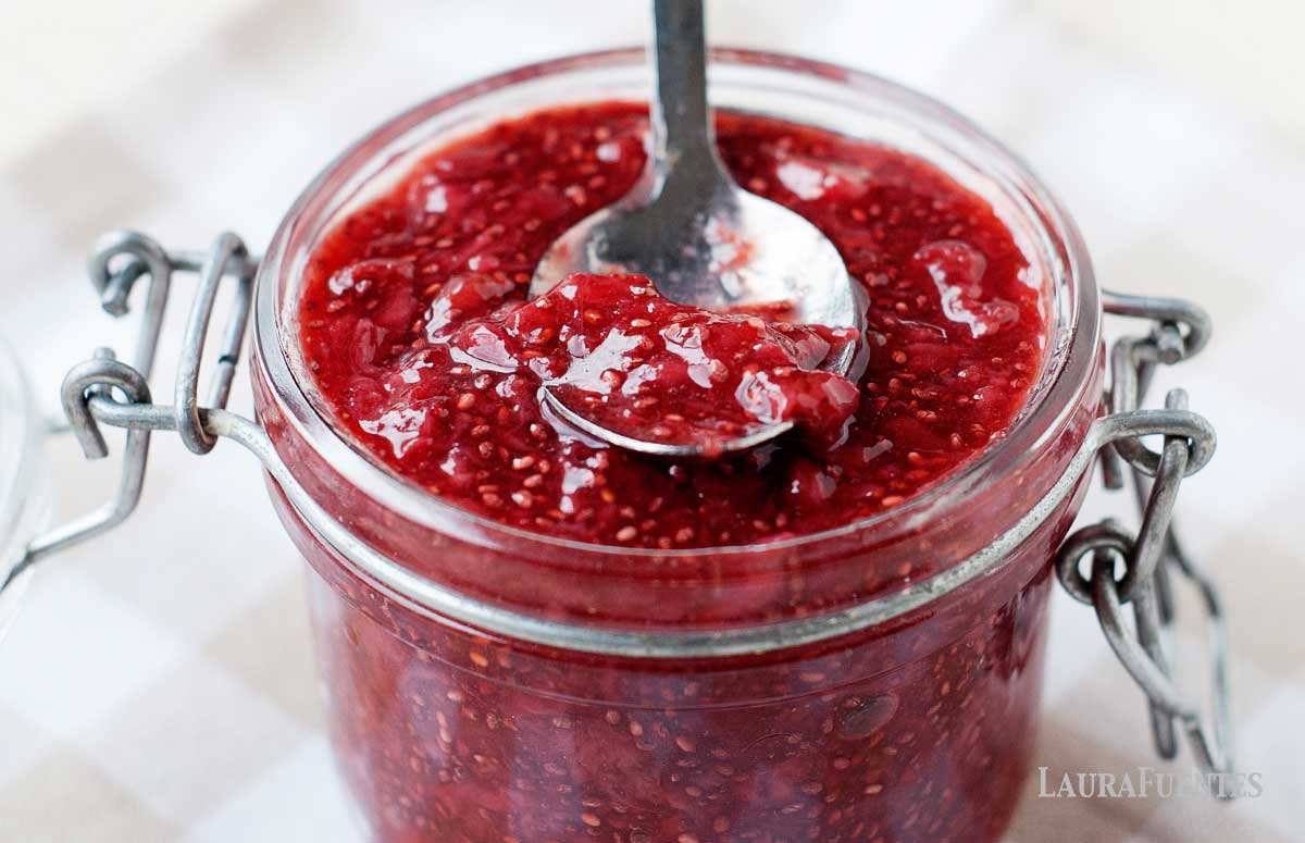 homemade chia seed jam in a glass jar with a spoon