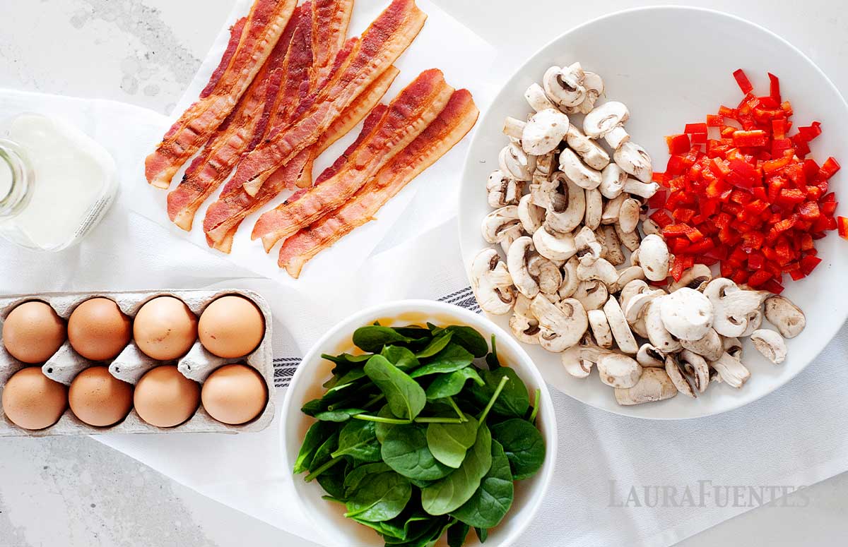 Spinach and bacon frittata ingredients: bacon, eggs, spinach, sliced mushrooms and bell peppers