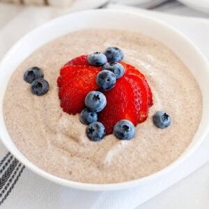 bowl of paleo oatmeal with berries on top