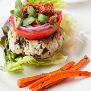 turkey burger on a plate with carrot fries