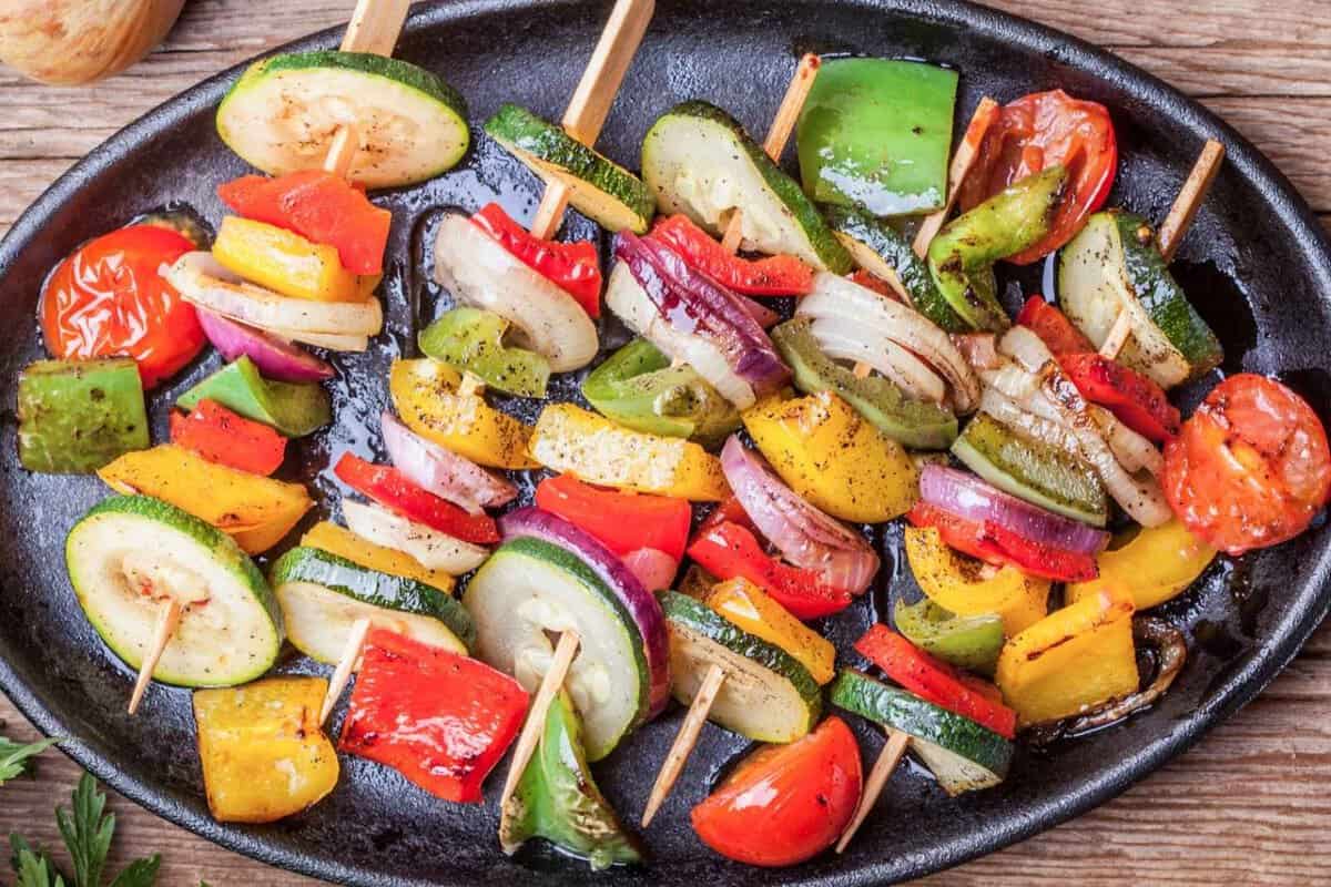 overhead view of veggie kabobs in a black tray