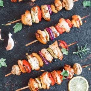 chicken and vegetable skewers laid out flat on a countertop