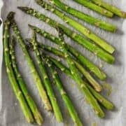 roasted asparagus in a lined sheet pan