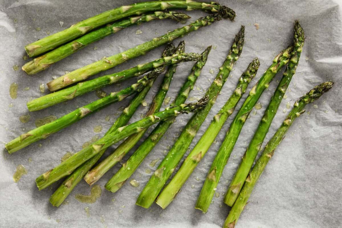 roasted asparagus in a lined sheet pan