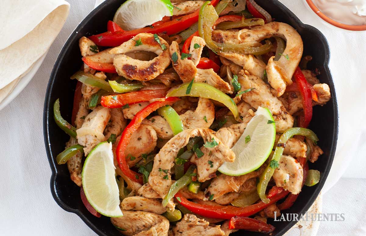 chicken fajitas in a large skillet
