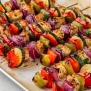oven kabobs after baking. kabobs are chicken and veggies