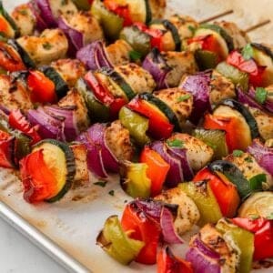 oven kabobs after baking. kabobs are chicken and veggies