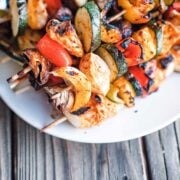 plate of chicken and vegetable kabobs