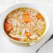 overhead view of a large bowl of turkey or chicken noodle soup