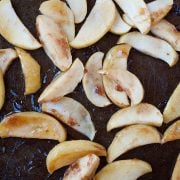 sliced apples on a baking sheet