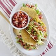 large platter of salsa verde chicken tacos