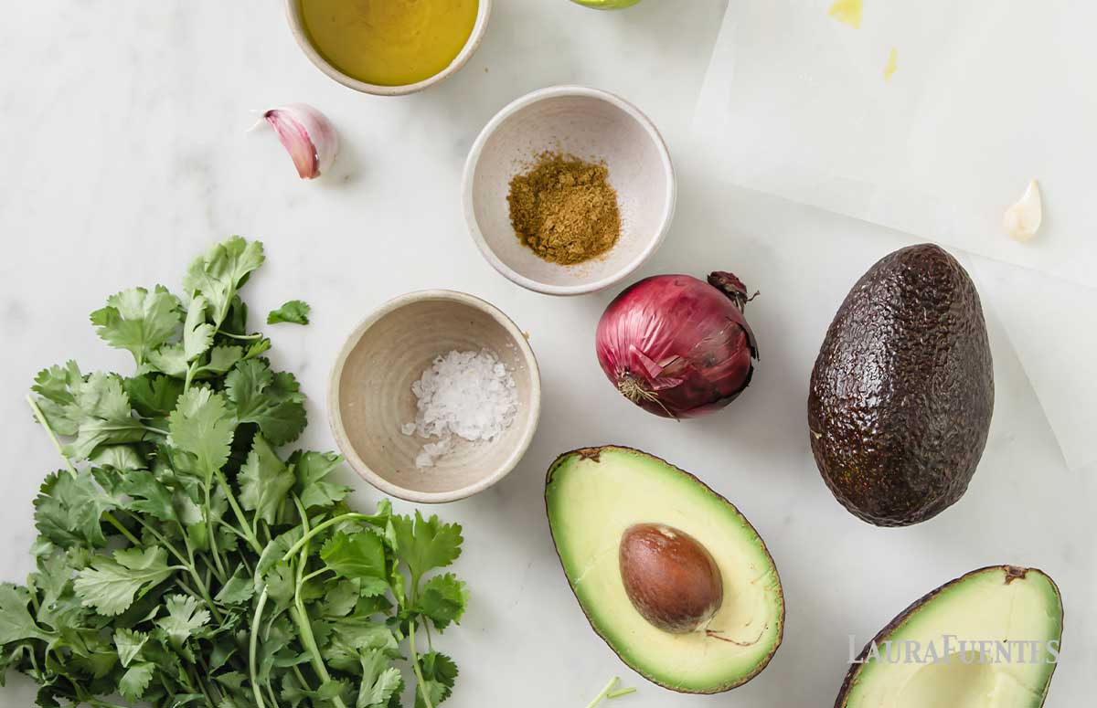 ingredients laid out for avocado salsa