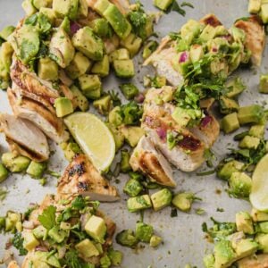 two cilantro lime chicken breasts with avocado salsa