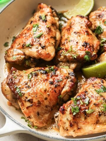 large skillet of cilantro lime marinated chicken thighs