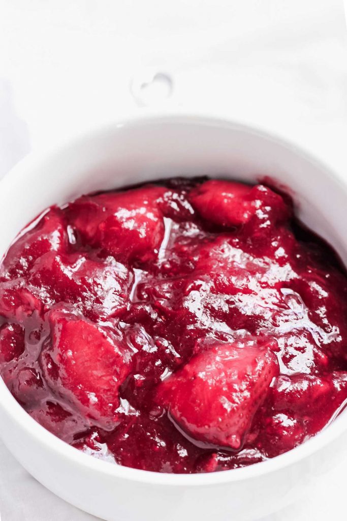 large bowl of cranberry sauce with strawberries