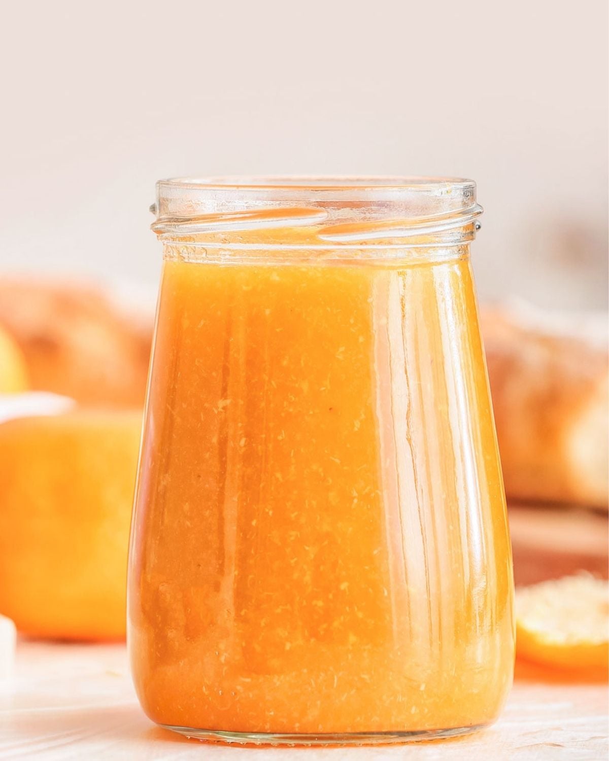 a jar of peach syrup