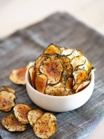 small white bowl of zucchini chips with no breading