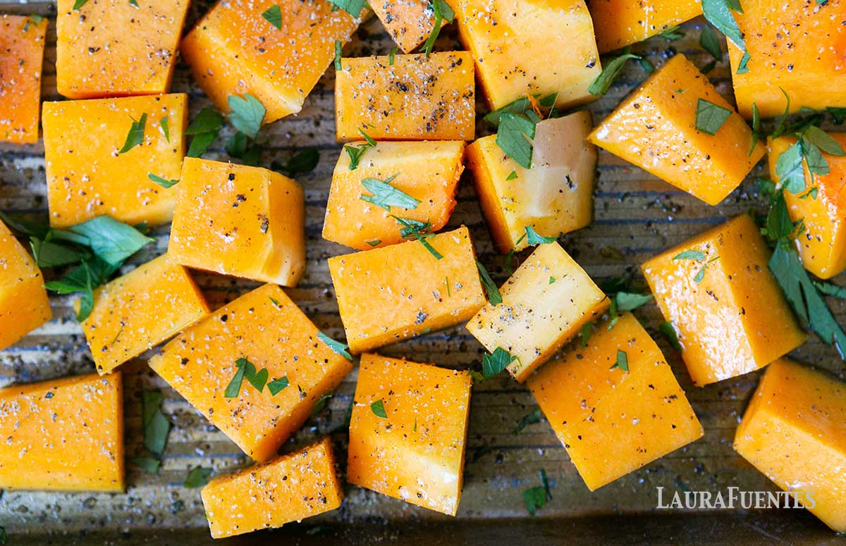 roasted butternut squash cubes on a baking sheet