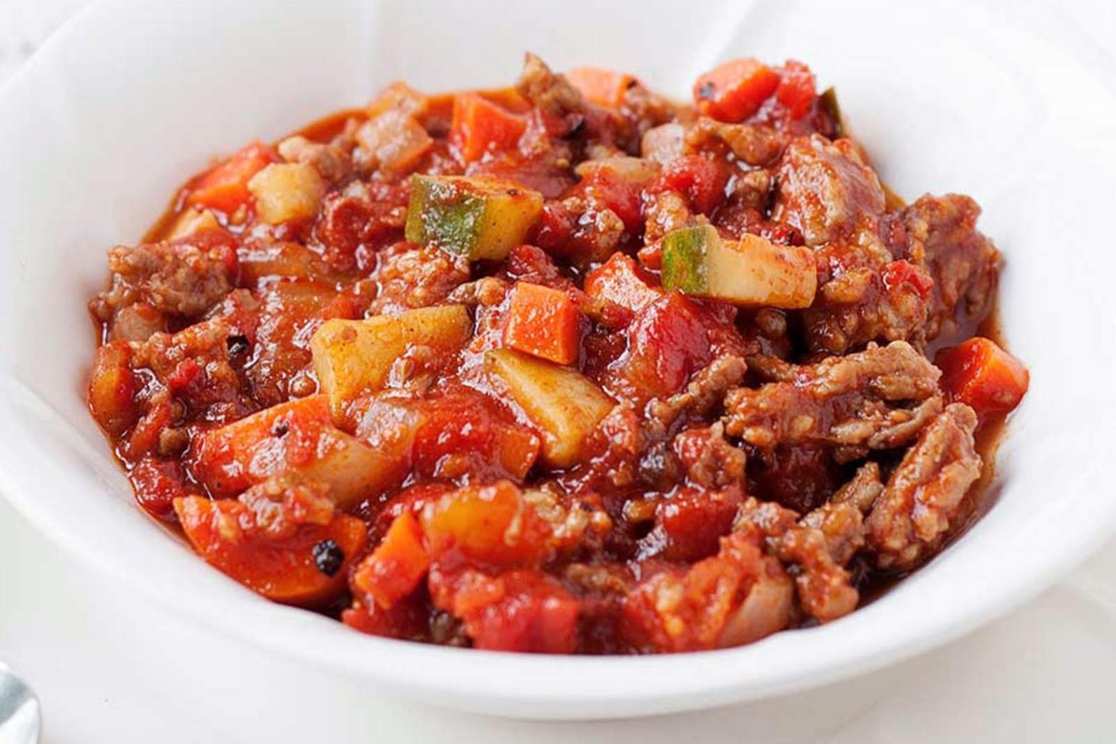 a bowl of ground chicken chili